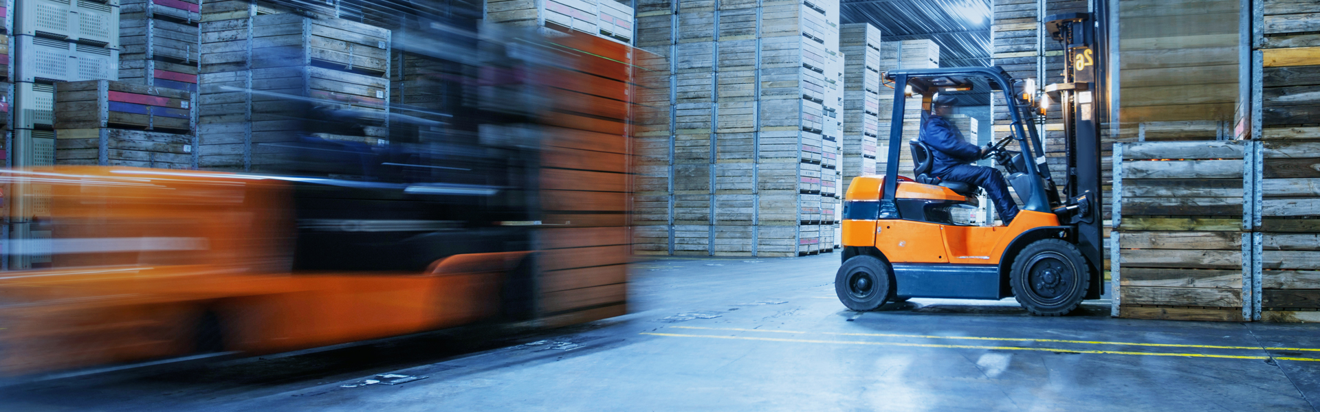 Forklifts in a warehouse: Equipped with Specialty Wheel for Forklifts by Maxion Wheels.