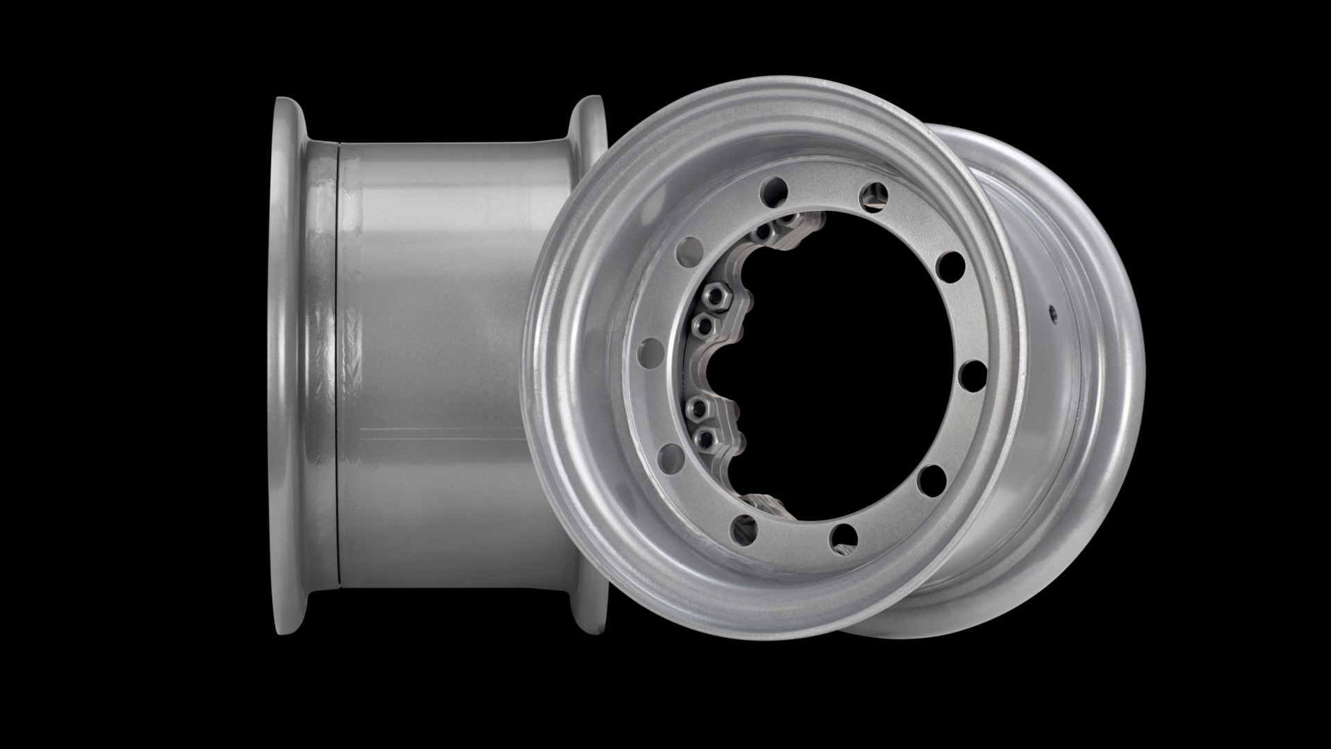 Two silver stell rims, one on the side, one at a left angle