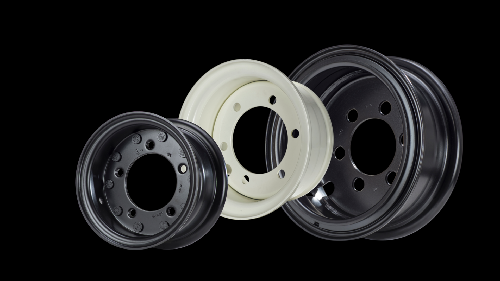Three colored steel rims, the smallest in black, the medium one in white and the largest one in black