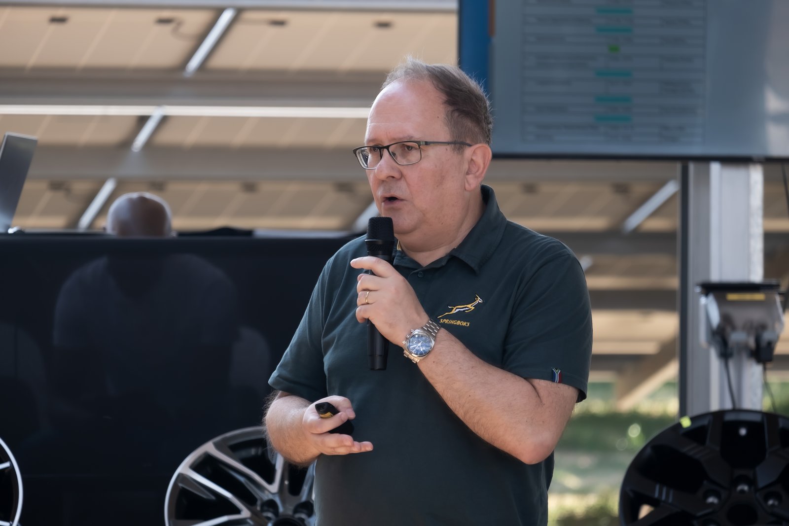 Milos Despotovic during his speech holding a microphone